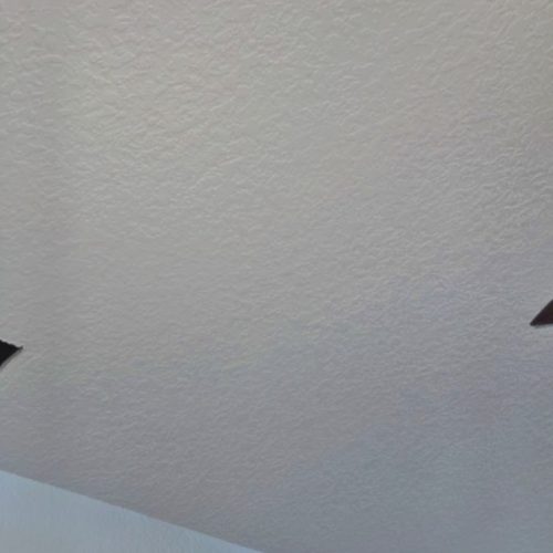 A clean, textured ceiling with two light fixtures visible in the corners, labeled "AFTER."